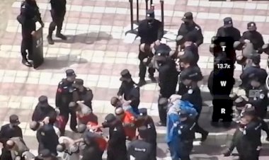 Uygurların gözleri bağlı, ayakları zincirli görüntülerine tepki